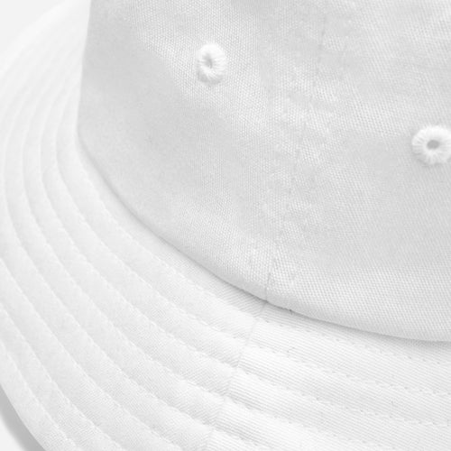 Détail du bob Dragon Flow – Édition France H2O RESPIRO blanc et de son motif dragon tricolore.
