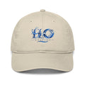 Casquette de baseball bio H2O RESPIRO de H2O RESPIRO, beige, en tissu, avec logo bleu sur l’avant et visière courbée.