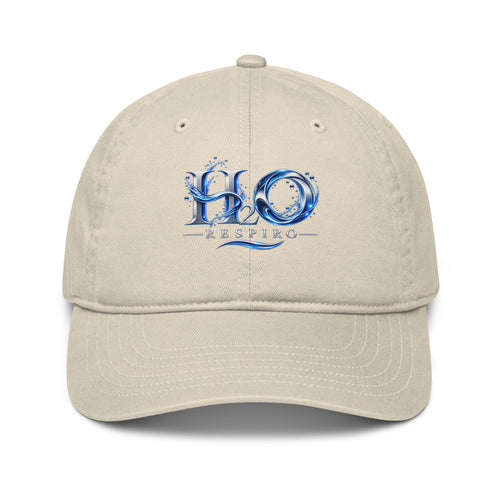 Casquette de baseball bio H2O RESPIRO de H2O RESPIRO, beige, en tissu, avec logo bleu sur l’avant et visière courbée.
